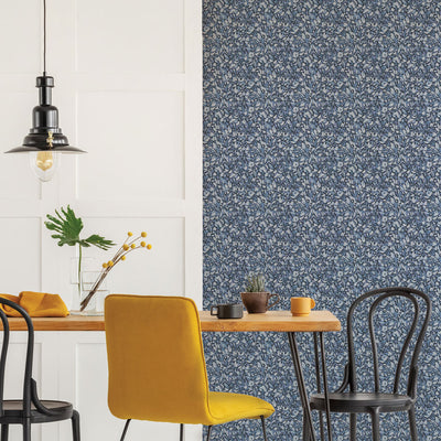 Tempaper's Flamboyan Peel And Stick Wallpaper By She She shown behind a table and chairs.