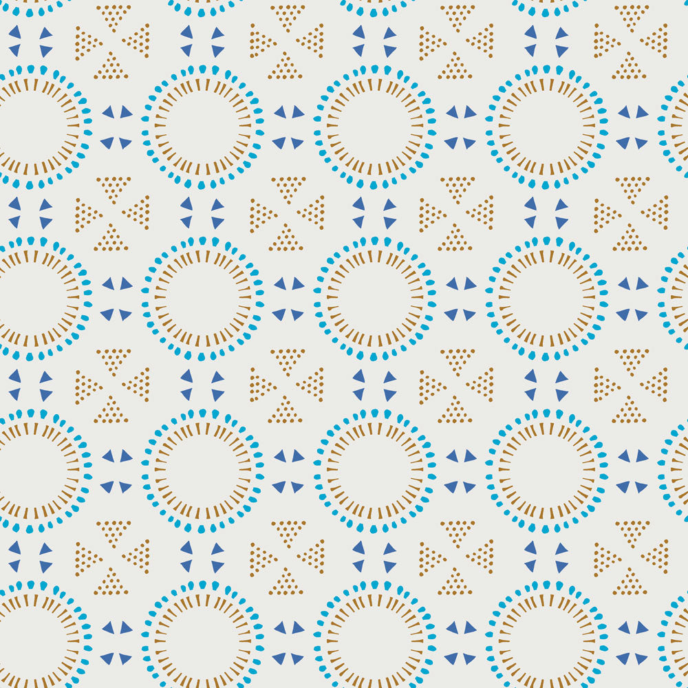 A dotted geo design with beige and bright blue, creating Tempaper's summer tan Breeze Tile peel and stick wallpaper.