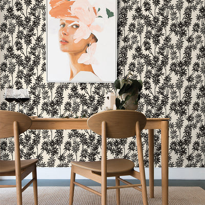 Tempaper's Daisy Bloom Peel And Stick Wallpaper By Novogratz shown behind a table, chairs, and a picture.