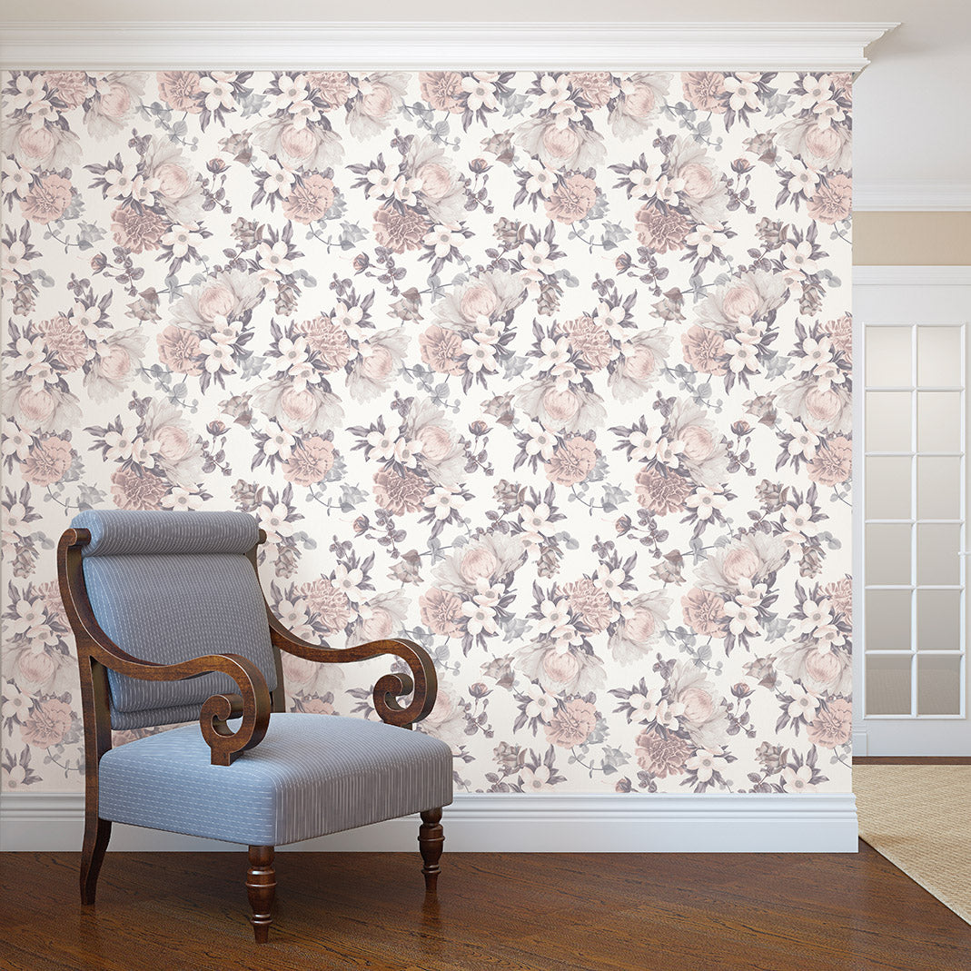 Botanical WALLPAPER in mauve pink displayed on an accent wall behind a chair.