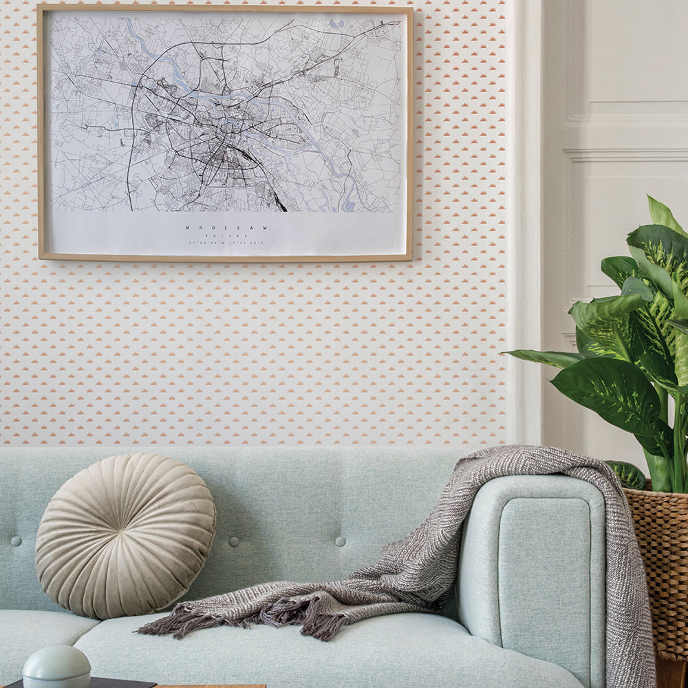 Tempaper's Sunbeam Peel And Stick Wallpaper with a blue couch and a plant.