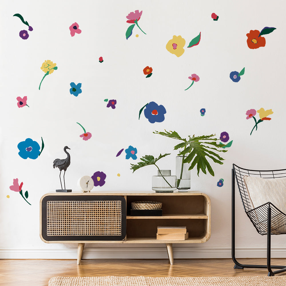 Abstract Flower wall decals are displayed on a white wall behind furniture.