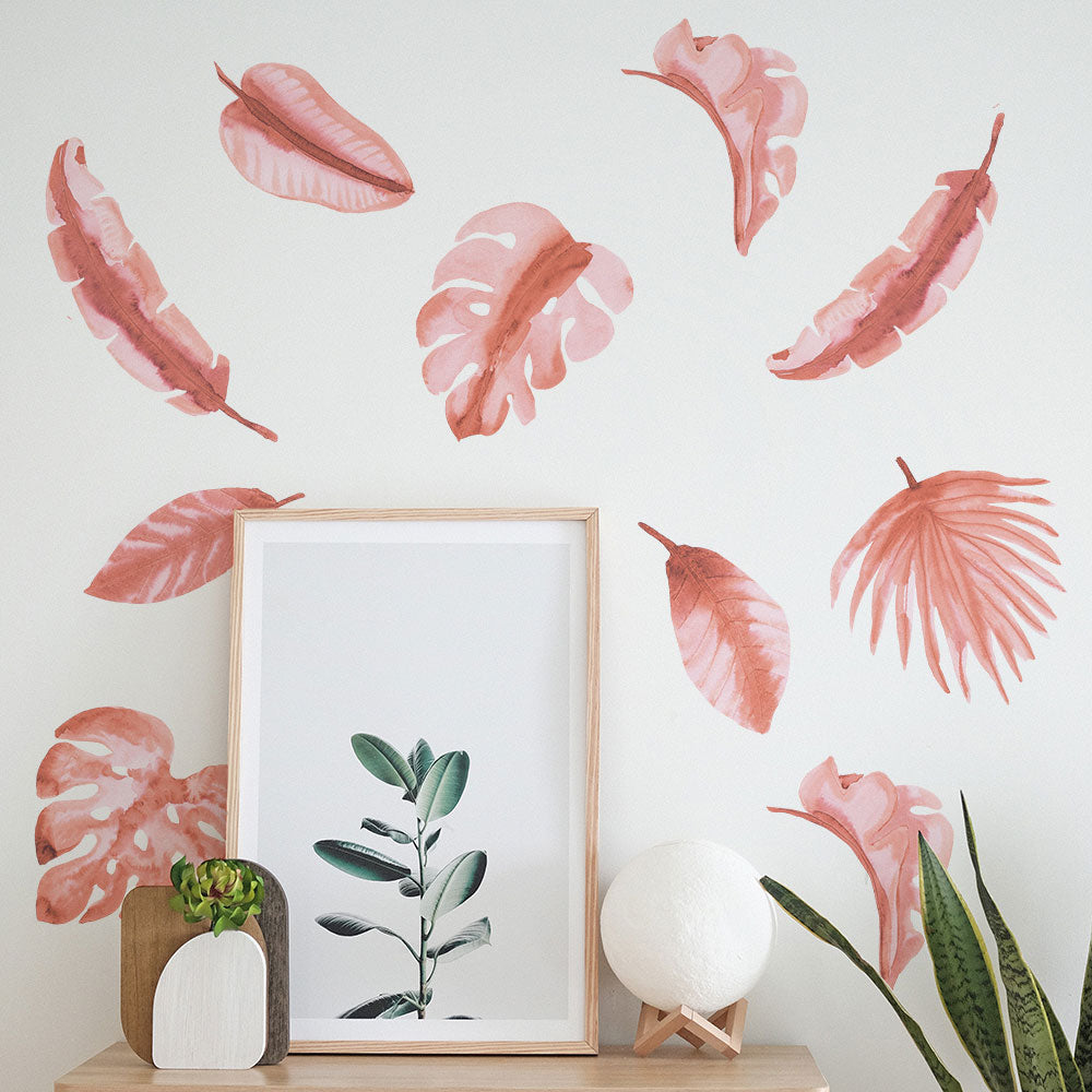 Tempaper's Watercolor Palm Leaf Wall Decals behind a picture frame.