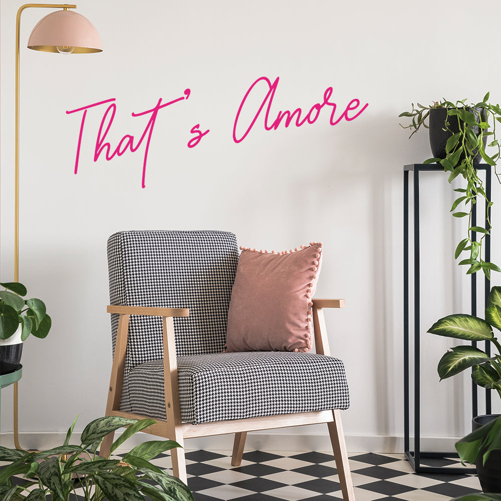 A plan room with a black and white checkered chair and Tempaper's That's Amore wall decal on the wall behind.