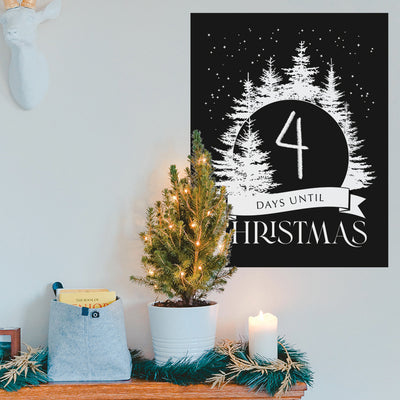 Tempaper's Christmas Countdown Wall Decal shown behind a plant.