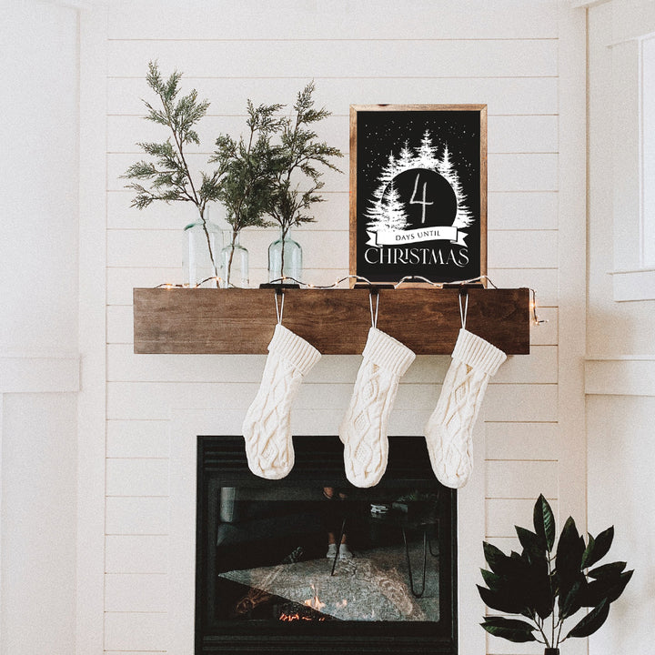 Tempaper's Christmas Countdown Wall Decal shown above a fireplace.