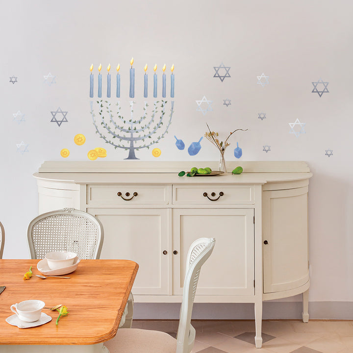 Tempaper's Festival of Lights Wall Decal shown with a table and chairs and behind a dresser.