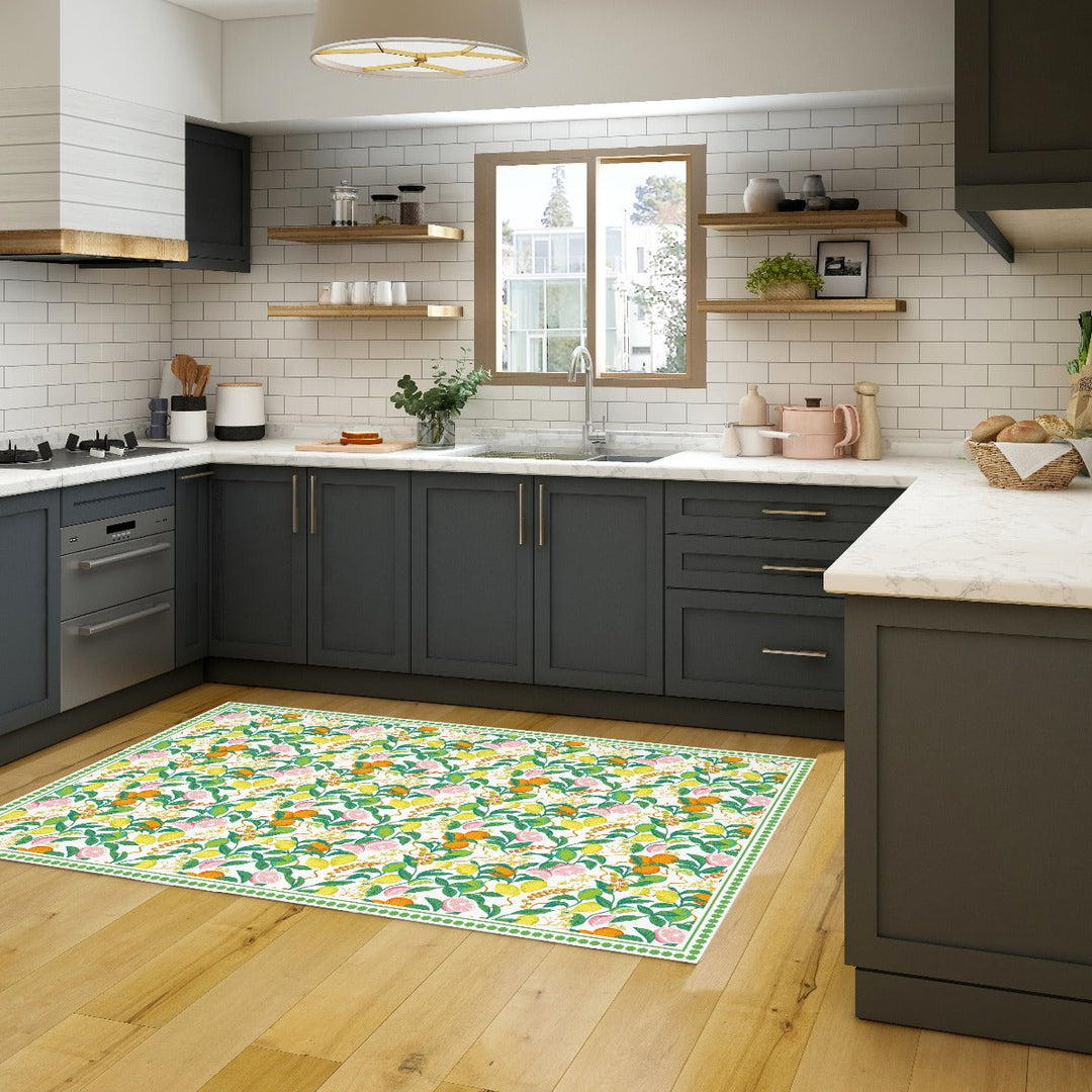 Tempaper's Citrus Vinyl Rug shown in a kitchen.#color_green-citrus