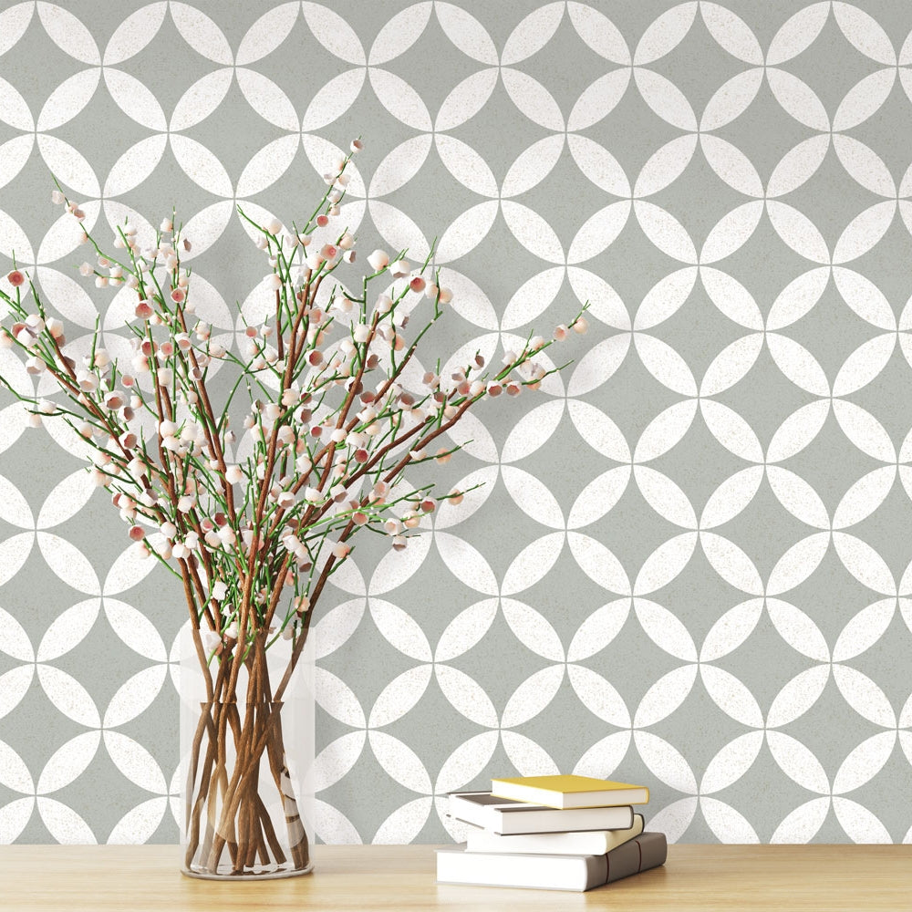 Terrazzo Star Removable Wallpaper - A wood table with four books and a vase in front of a wall featuring Terrazzo Star Peel And Stick Wallpaper | Tempaper