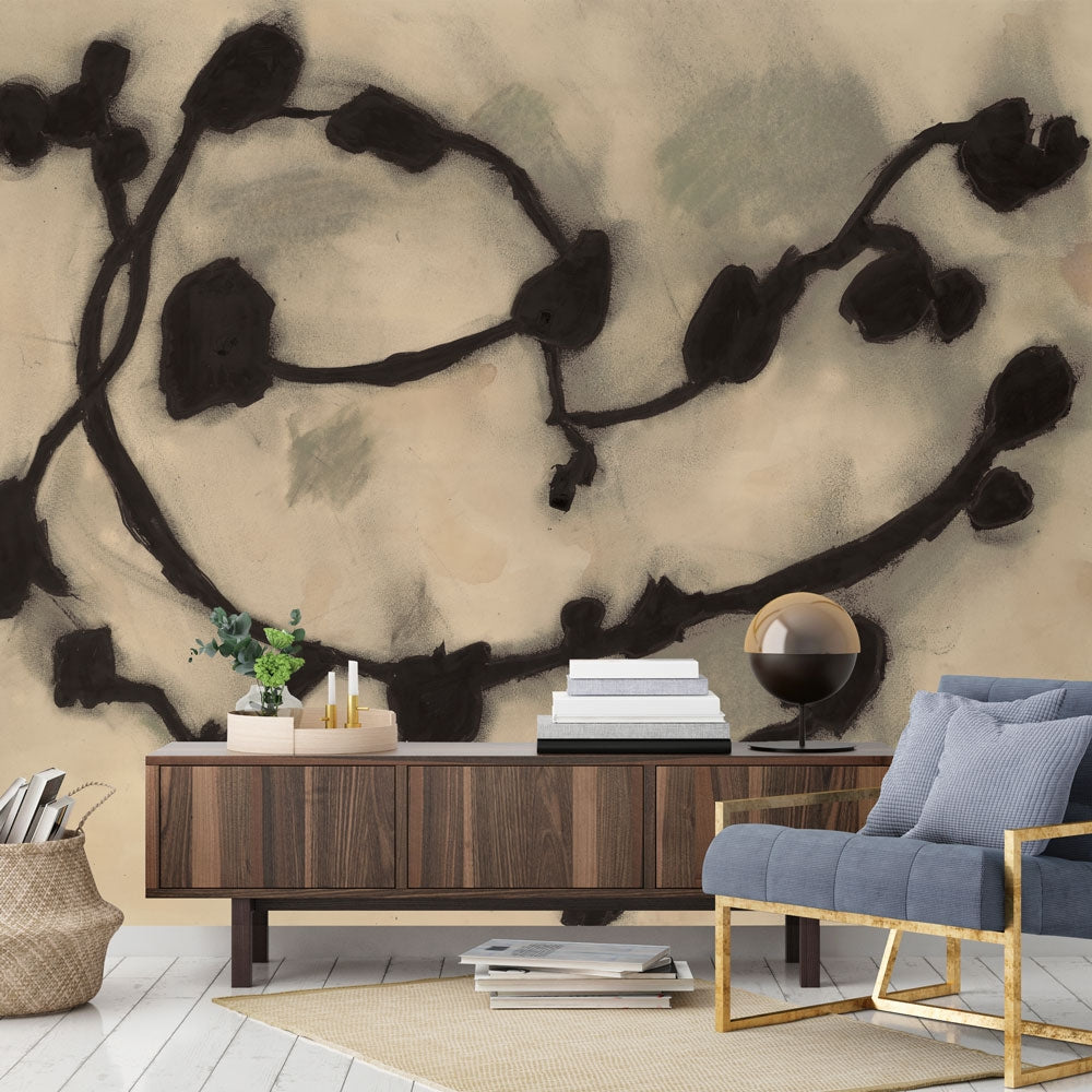 An up close swatch of Tempaper's Dark Vines Peel And Stick Wall Mural By Zoe Bios shown behind a sideboard and chair.