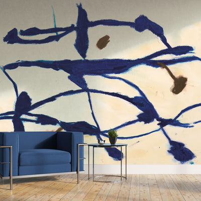 Tempaper's Figures Peel And Stick Wall Mural By Zoe Bios shown behind a couch.