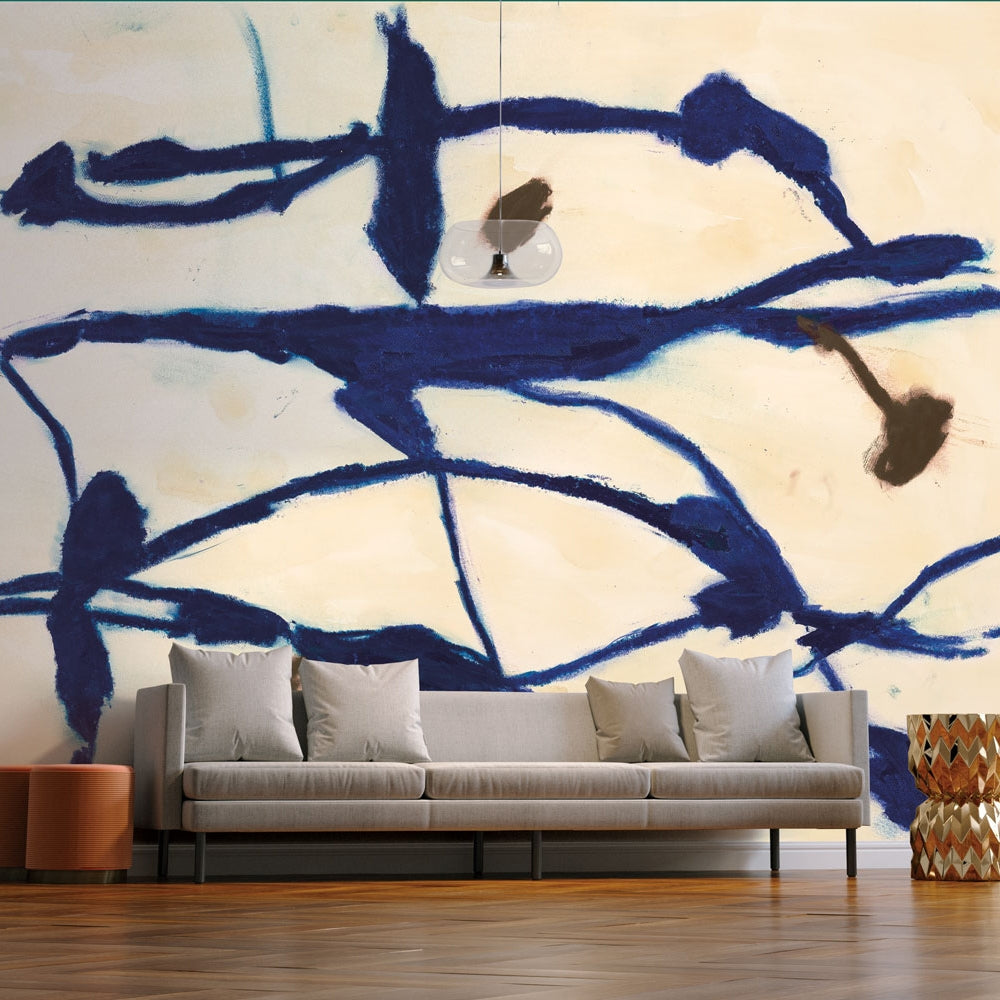 Tempaper's Figures Peel And Stick Wall Mural By Zoe Bios shown behind a couch.